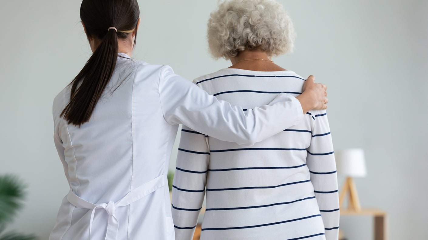 Doctor helping patient